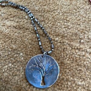 Artisan quarter coin turned into a tree engraving pendant with chain.